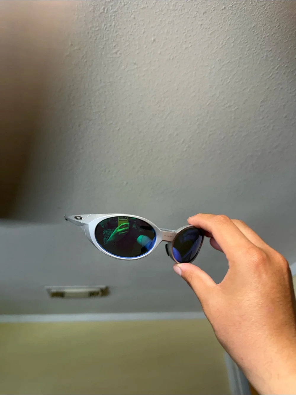 Silver Frame Sunglasses with Mirrored Blue-Green Lenses Oakley